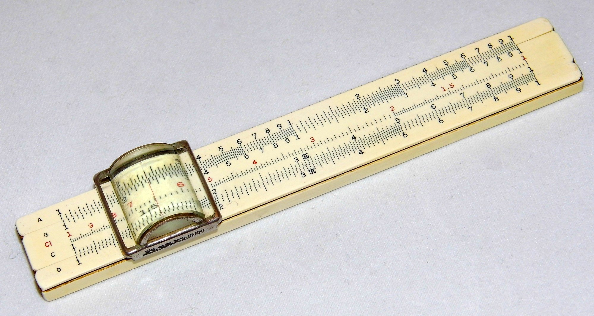 Figure 4 — A Frederick Post No. 1441 four-inch pocket slide rule made by Hemmi in Occupied Japan, with a large cylindrical magnifying cursor in a metal frame stamped SUN HEMMI.
