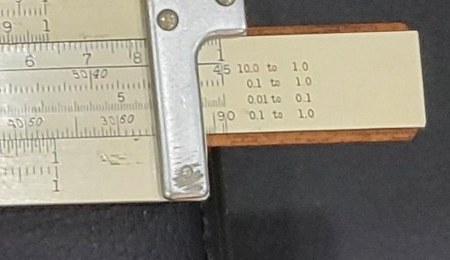 Figure 6 — The right end of my 4071-3's slide on the reverse face: four printed legends, "10.0 to 1.0" and "0.1 to 1.0" beside T, "0.01 to 0.1" beside ST, and "0.1 to 1.0" beside S.