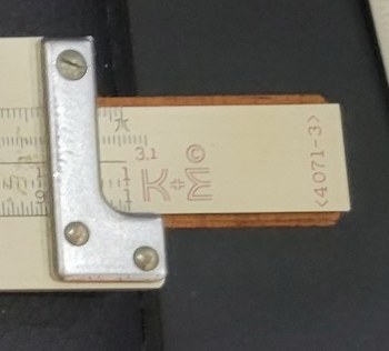 Figure 4 — The right end of my 4071-3's slide on the front face, drawn out past the end bracket: a red star, "3.1", the K&E logo with ©, and the model number "‹4071-3›" printed vertically.