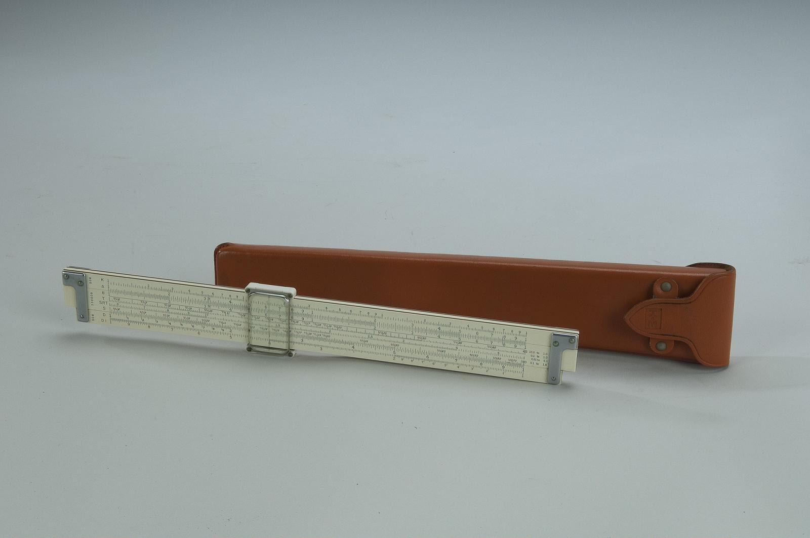 Figure 2 — A Smithsonian K&E 4071-3 lying in front of its orange-brown leather case with the K&E logo on the flap.