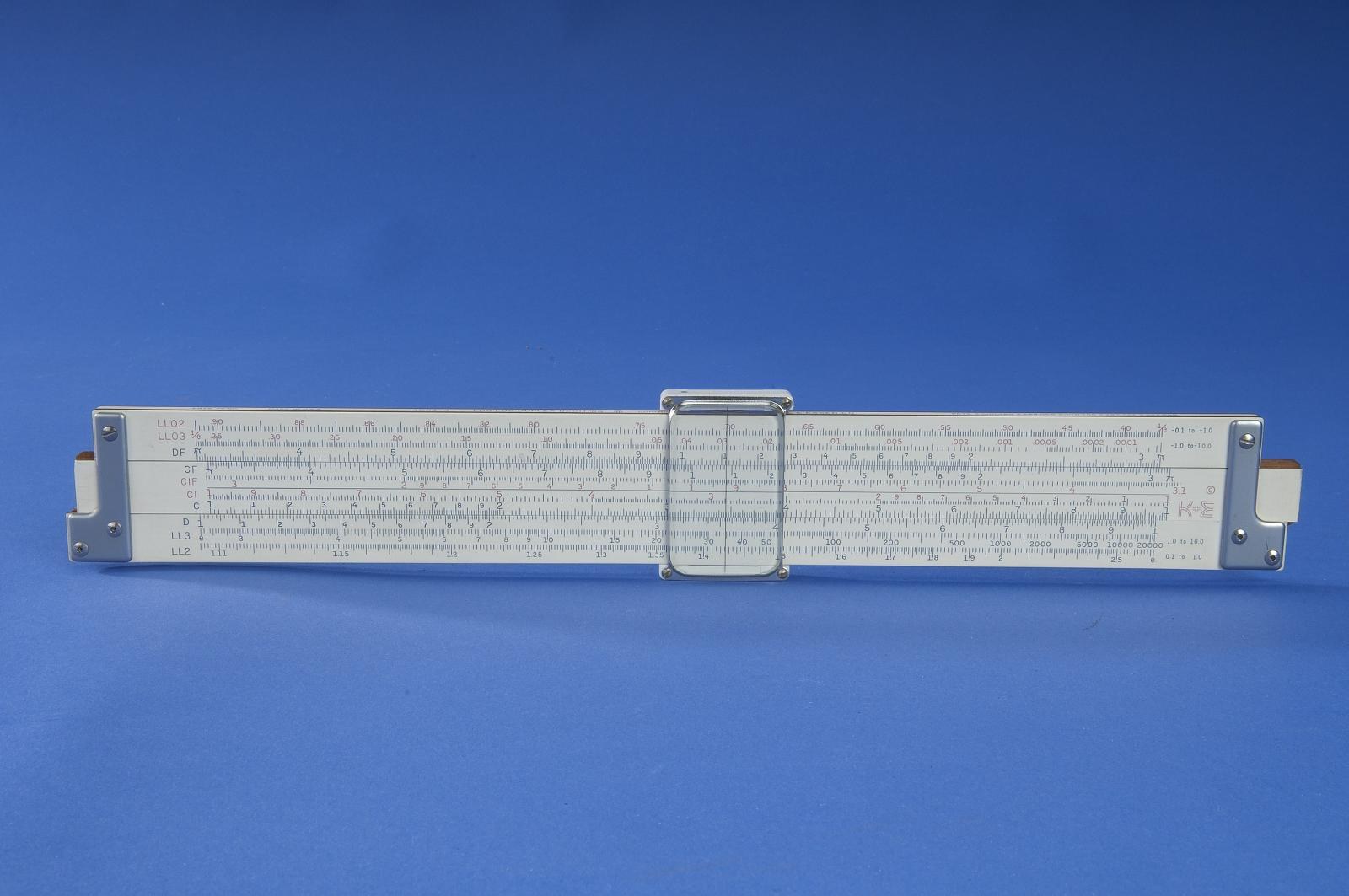 Figure 5 — A Smithsonian K&E 4081-3 of about 1957 on a blue background, log-log face up, with the same layout as my rule and a metal-barred cursor.
