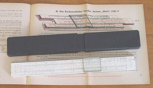 Figure 2 — A Nestler 23 R/3 with its cardboard case, lying on Nestler's 40-page booklet "Einführung in die Anwendung der Nestler Rechenschieber Rietz und Darmstadt".