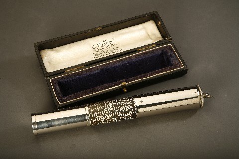Figure 2 — An early Otis King with nickel-plated tubes, a ring on the end cap, and a fitted presentation case lined in silk, its lid printed "Otis King's Calculator."