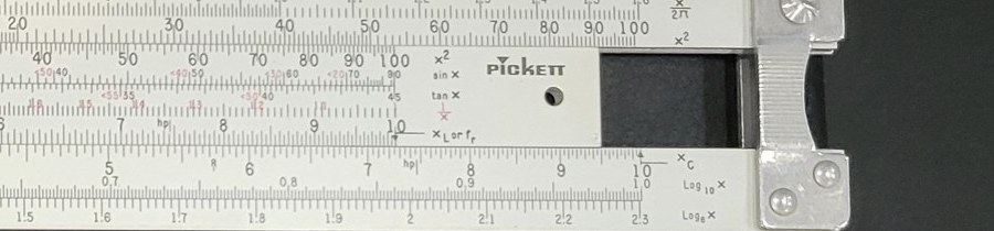 Figure 3 — Close view of the right end of my N-515-T showing the right-hand function labels x/2π, x², sin x, tan x, X L or f r, X C, Log10 x and Loge x, and the block-letter PICKETT logo on the slide.