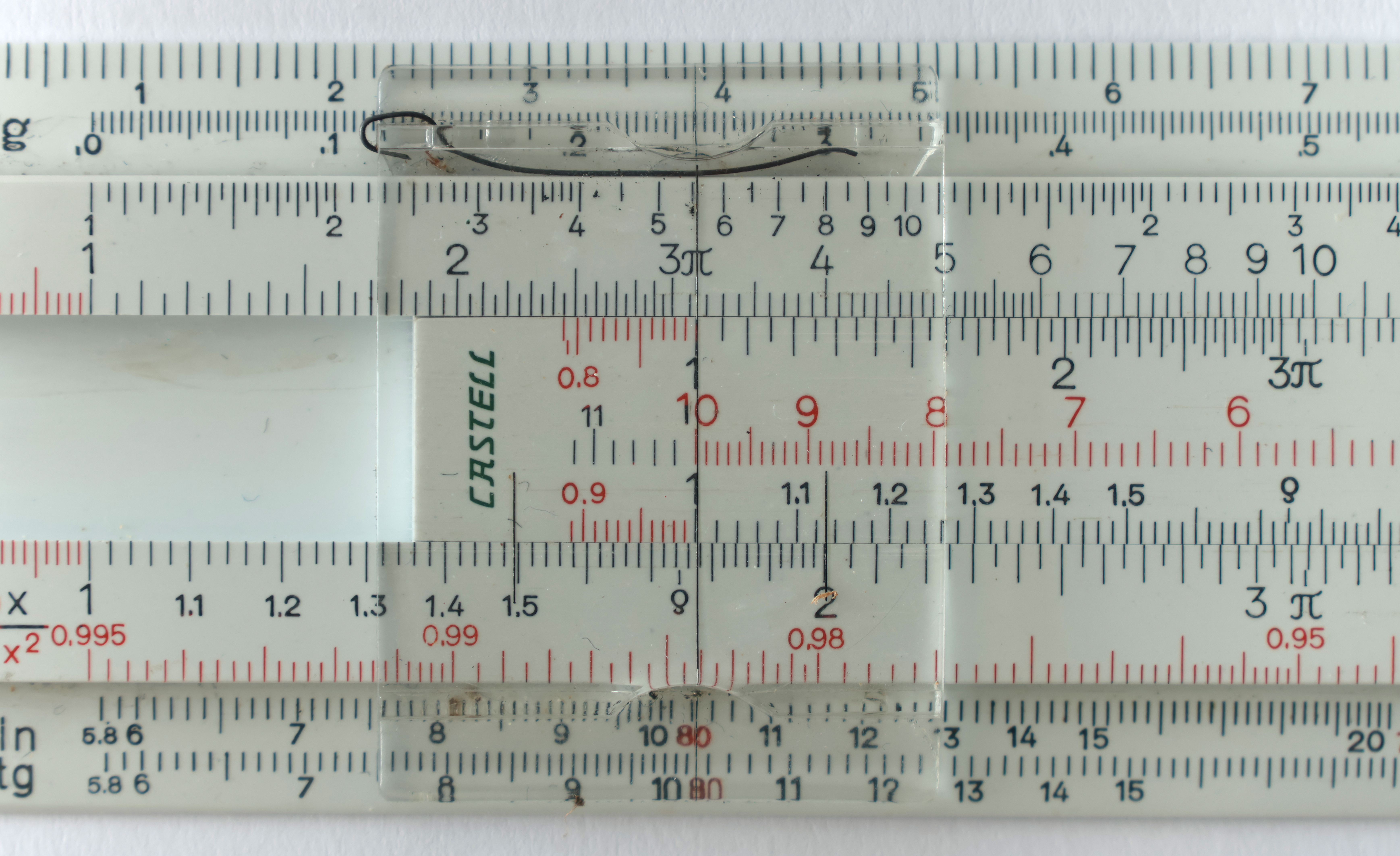 Figure 3 — A close-up of slide-rule scales under the cursor, with the fine graduations between the numbered marks clearly visible.